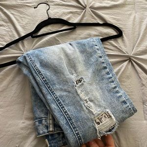 Blue jeans with a black and white patch